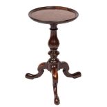A mid 18th Century mahogany circular wine table:, with a moulded tray top,