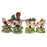 Two Walton pearlware ram and ewe bocage groups and two similar: each with a lamb lying amongst