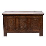 A late 17th Century oak rectangular coffer:, with a plain hinged moulded top,