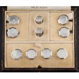 A cased set of Art Deco mother of pearl and seed pearl mounted octagonal cuff-links,