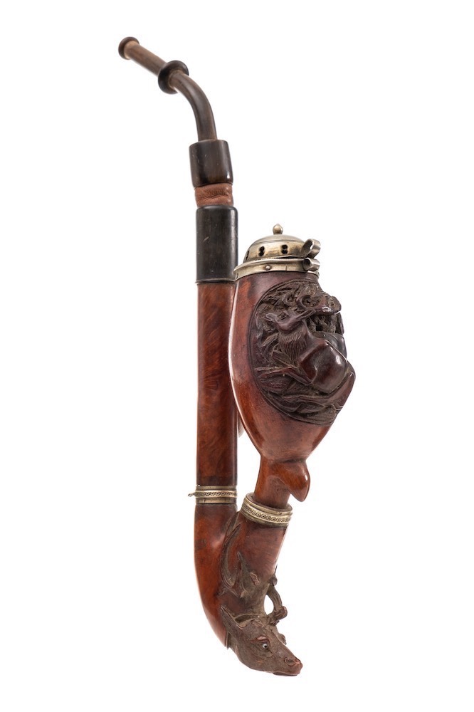 A late 19th/early 20th Century German carved briar pipe: the bowl decorated with a stag and doe,