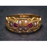 A 19th Century ruby and seed pearl eight-stone ring: approximately 3.5gms gross weight, ring size N.