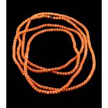 A long coral bead single-string necklace: each bead approximately 4.5mm, 44gms gross weight.