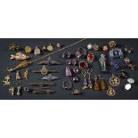 A collection of charms, pins, gold jewellery items, an amethyst single-stone ring,