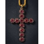 An early 19th Century gold and foiled garnet pendant cross: composed of eleven rosette circular