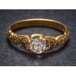 A mid 19th Century gold and diamond single-stone ring: the round old brilliant-cut diamond