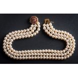 A cultured pearl three strand choker necklace with attached 18ct gold,
