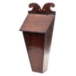 An 18th century mahogany candle box: of rectangular tapering form with hinged lid, 48cm high.