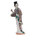 A Chinese porcelain figure of an elegant lady: dressed in flowing robes,