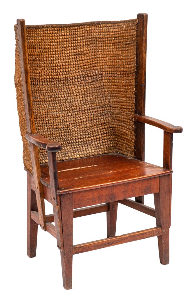 A 19th Century oak and pine Orkney Islands wing armchair:, having a curved ropework back,