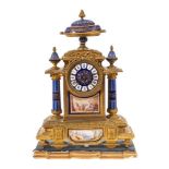 A French gilt-metal and porcelain mantel clock: the eight-day duration movement striking the hours