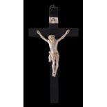 A 19th Century Continental carved ivory and ebony crucifix: 25cm high.