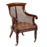 A William IV mahogany bergere armchair:, with curved bar 'paper scroll' toprail,