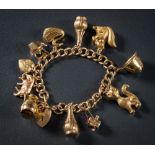 A 9ct gold curb-link bracelet: with eleven various attached 9ct gold charms to include squirrel,