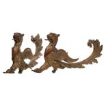 A pair of 19th century gilt brass London Griffon wall appliques: open mouthed with tongue,