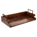 A 19th Century rosewood book trough: of rectangular outline,