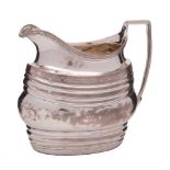 A George III silver cream and jug, unknown maker, London, 1801: of barge-shaped outline,