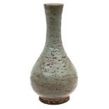 A Chinese celadon glazed vase: of tear drop form with slender mildly waisted neck,