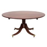 A Regency mahogany circular dining table:, the snap top with a reeded edge,