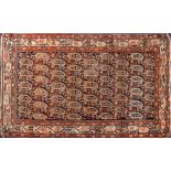 A Melayer rug:, the shaded field with an all over design of geometric boteh,