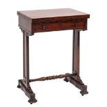 An early Victorian rosewood games and work table:, with a rectangular baize lined hinged top,