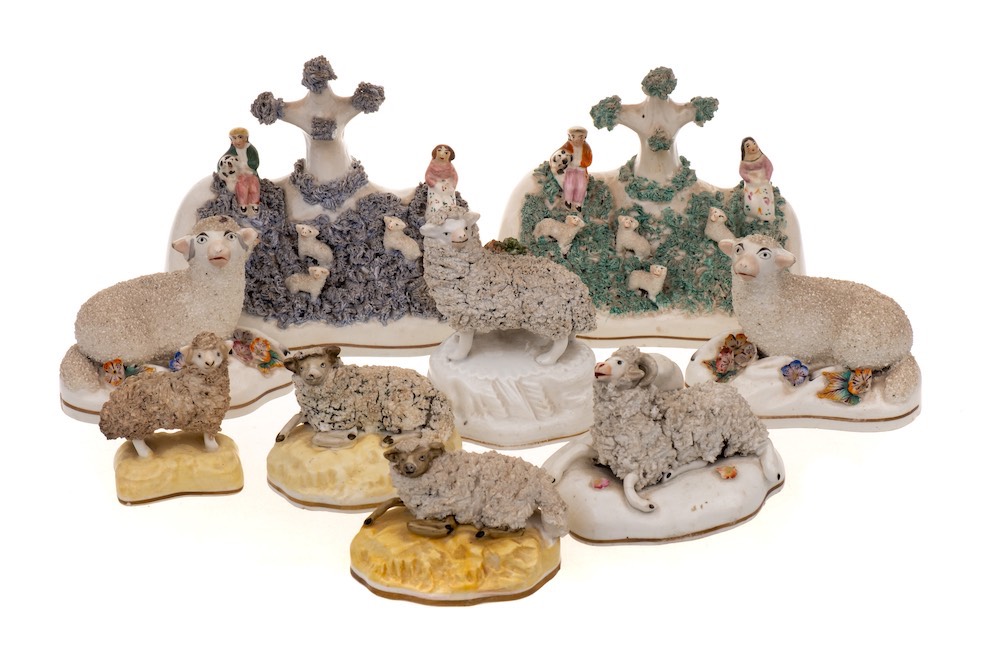 A group of 19th century porcelain and porcelainious sheep models and groups with naturalistic