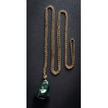 A bloodstone boulder pendant approximately 42mm long x 34mm wide, on an oval-link guard chain.