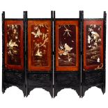 A Japanese carved and ebonised four fold screen:,