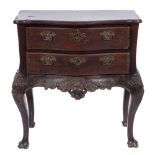A 19th Century Portuguese carved hardwood serpentine fronted commode:,
