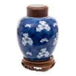 A Chinese blue and white vase and a similar small ginger jar: the first painted with scrolling