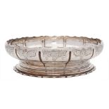 A George V silver shallow bowl, maker Carrington & Co, London, 1913: of circular panelled outline,