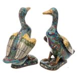 A pair of Chinese cloisonne models of ducks: each seated with wings slightly outstretched and