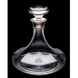 A clear glass ship's decanter: with simple mushroom stopper and silver mounted neck, J.A.