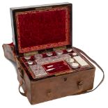 A Victorian coromandel and brass strung travelling toiletry box: the hinged lid enclosing a fitted
