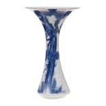 A Japanese blue and white trumpet-shaped vase: in Fukagawa style, painted with a large pine tree,