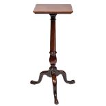A mid 18th Century mahogany candle table:, the square top with rounded corners,