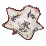 A Plymouth leaf shaped pickle dish: painted in underglaze blue and iron-red with narcissus and