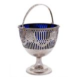 An Edwardian silver swing handled cream pail, maker Thomas Bradbury & Sons Ltd: monogrammed,