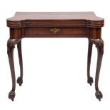 A George II carved mahogany triple top games table: with projecting rounded corners,