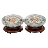 A pair of Chinese doucai circular boxes and covers: each decorated with three dragon and phoenix