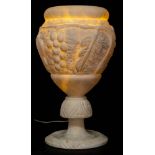 A late Victorian alabaster table lamp: of ovoid outline with low relief decoration of grapes and