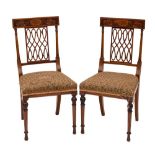 A pair of Edwardian mahogany and marquetry dining chairs:, bordered with boxwood lines,