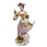 Two Meissen figures: the first of a shepherdess, wearing a yellow bodice,