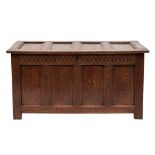 An 18th Century oak rectangular coffer:, of moulded panel construction,