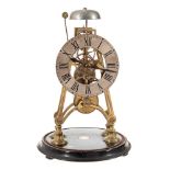A late 19th Century English brass skeleton clock: the eight-day duration timepiece fusee movement