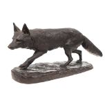 A bronze study of a prowling fox: mounted on an oval naturalistic base, unsigned, 57cm long.