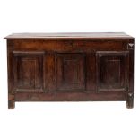 An 18th Century oak rectangular coffer:, with a plain hinged moulded top,