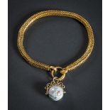 A 19th Century brazilian link bracelet: with attached globe charm.