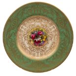 A Royal Worcester porcelain cabinet plate: the centre painted by Walter Austin with exotic garden