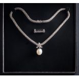 A cultured pearl and diamond mounted pendant: the cultured pearl approximately 14.